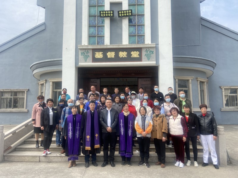 Church leaders and believers in Changzhou City took a group picture during a tree-planting event at Hengshanqiao Church in Changzhou Economic Development Zone, Jiangsu, on March 11, 2023.