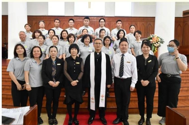 Pastors and new believers of Guangxiao Church in Guangzhou, Guangdong, took a group picture after a baptism service held on March 19, 2023.