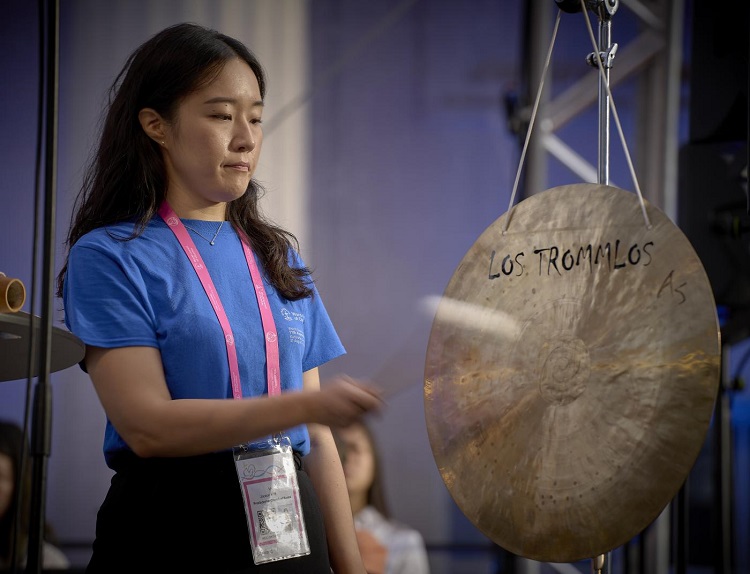 Jooeun Kim of the Presbyterian Church of Korea stroke a gong to begin a morning prayer service at the 11th Assembly of the World Council of Churches, held in Karlsruhe, Germany, 6 September 2022. 