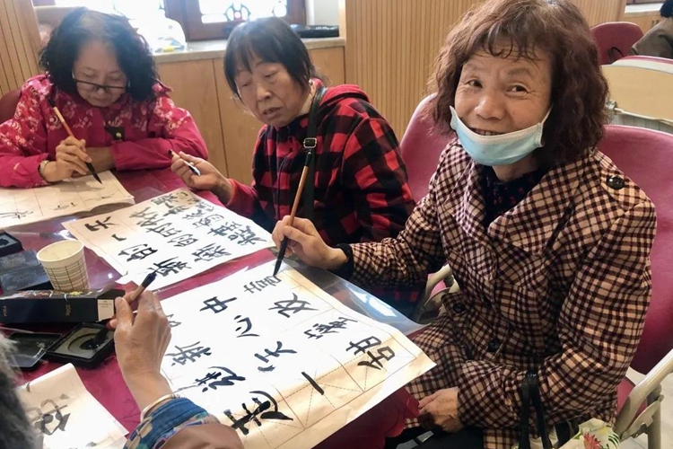 Several female members of Chuncheng Church in Changchun, Jilin, engaged in the practice of calligraphy using Chinese brushes at an unknown date.