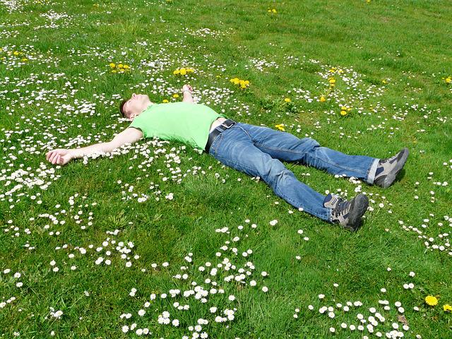 A picture of a man lying on the grass