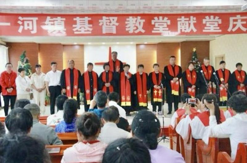 Believers and church staff took a group photo during the dedication ceremony for a new church building in Keyihe Town, Ewenki Autonomous Banner, Hulunbuir City, Inner Mongolia, on June 29, 2023.