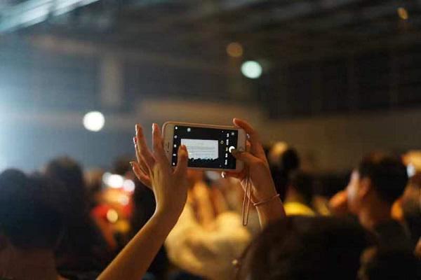A person took a picture of the screen during a worship revival summit themed "Revival" held by Stream of Praise (SOP) Music Ministries at the Hong Kong Convention and Exhibition Center on August 6th, 2023.