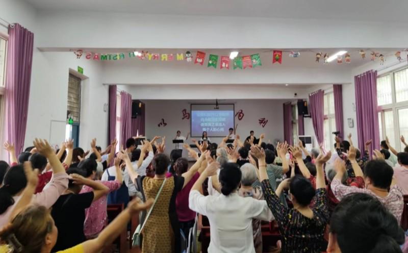 Believers stood and raised their hands, praising God, during a ‘Arise for You"-themed praise meeting at the Xinhe Town gathering site in Xixia District, Nanjing City, Jiangsu Province, on August 27, 2023.