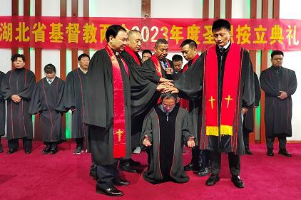 The pastorate from Hubei Provincial CC&TSPM laid their hands on a male staff member during an ordination service held at Suizhou Church in Hubei on November 26, 2023.