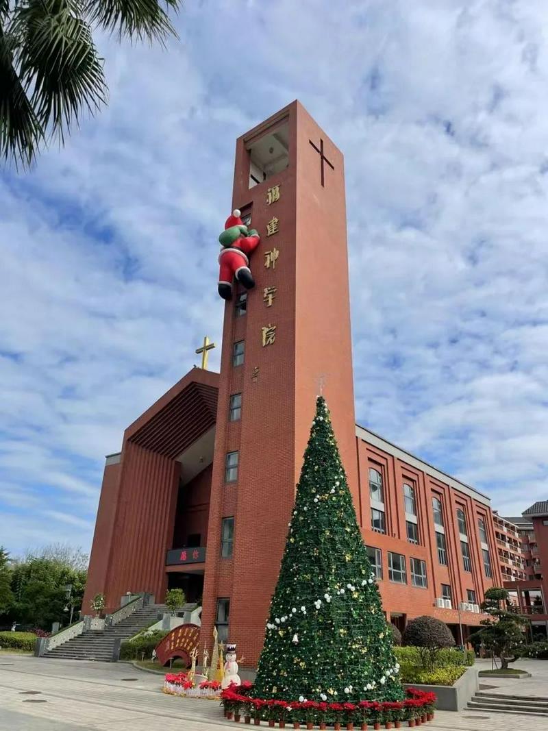 A huge inflatable Santa Claus "climbs" outside the wall of the Fujian Theological Seminary to celebrate Christmas during the 2023 Christmas season.