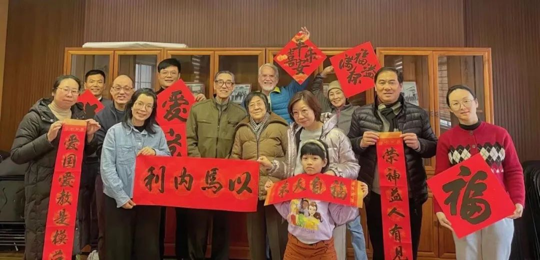 Chinese and foreign believers took a group photo holding Christian Spring Festival couplets during the Spring Festival social event for Chinese and foreign believers held by Qingpu District CC&TSPM in Shanghai City before the 2024 Chinese Spring Festival.
