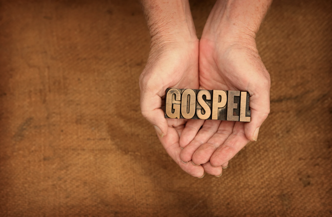 A picture of letters spelling out "Gospel" in cupped hands
