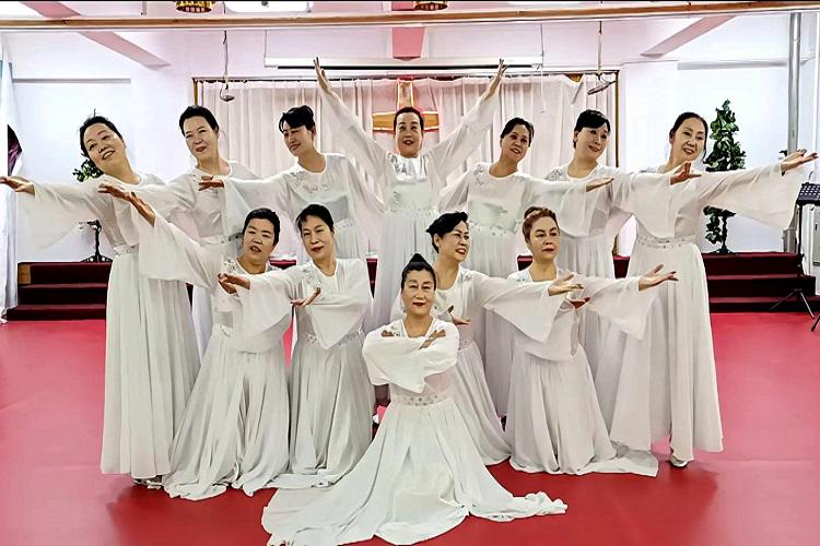 Christian ladies, dressed in white skirts, performed a dance during a praise meeting held at Lvhua Street Church in Anshan, Liaoning, on January 31, 2024.