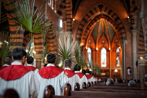 Choir members entered the main building with palm branches to observe the Palm Sunday service conducted at Holy Trinity Cathedral in Shanghai on March 24, 2024.
