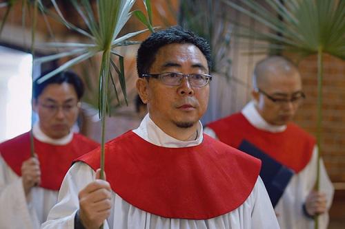 Choir members held palm branches to observe the Palm Sunday service conducted at Holy Trinity Cathedral in Shanghai on March 24, 2024.