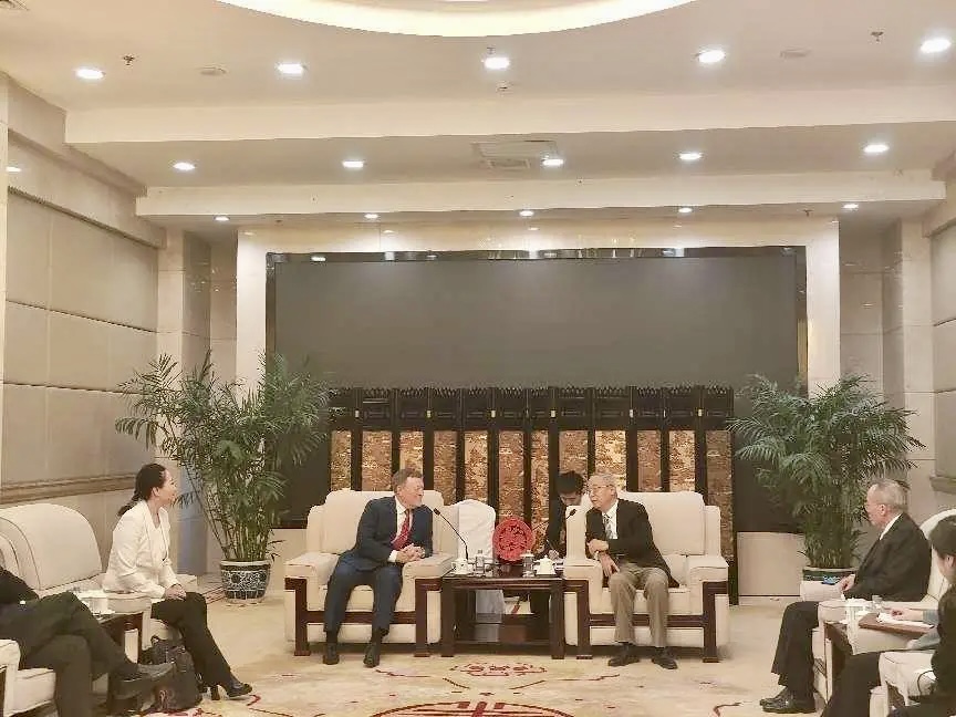 Dr. Gene Wood (left), founder and president of Word4Asia Consulting International, and Ai Ping (right), vice president of the Chinese Association for International Understanding (CAFIU) engaged in exchanges in Beijing on March 21, 2024.
