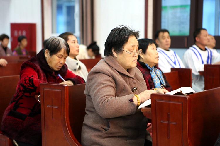 Several elderly believers listened carefully to a sermon during a communion service at Qinghemen District Church, Fuxin, Liaoning, on Maundy Thursday, March 28, 2024.