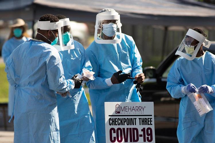 Volunteers from Meharry Medical College in Nashville, USA, prepare to help patients at a drive-thru testing site for COVID-19 at St. Luke Christian Methodist Episcopal Church in Nashville. Teams from the United Methodist-related school offered testing at area churches on Saturdays in July 2020.