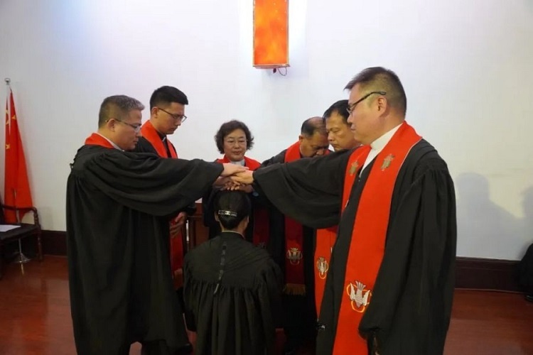 The pastorate from Shandong CC&TSPM and Jinan CC&TSPM laid hands on a female pastoral worker during an ordination ceremony at Jingsi Road Church in Jinan, Shandong, on May 12, 2024.
