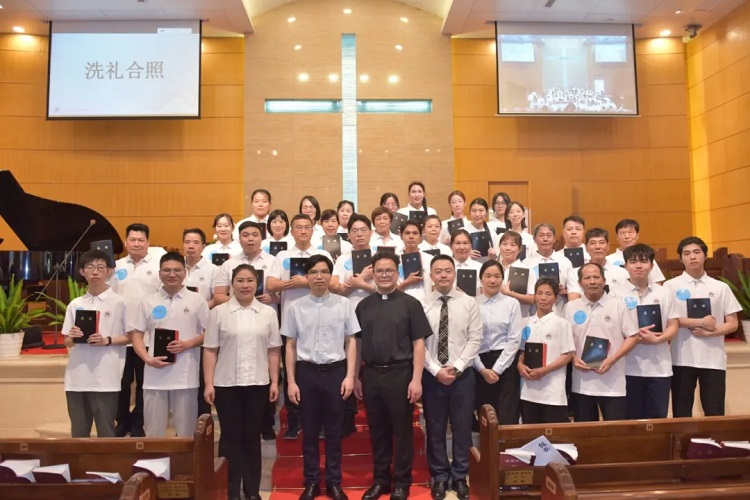 New believers with bibled were pictured with pastors after a baptism service hosted at Zion Church in Guangzhou, Guangdong, on May 26, 2024.