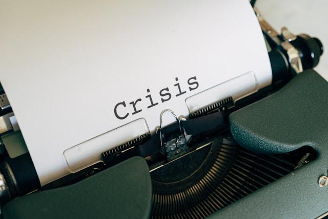 A machine printed with the word of "crisis"