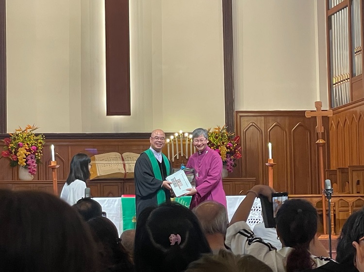 Primate Andrew Chan Au-ming of Hong Kong Sheng Kung Hui and Senior Pastor Wu Zhongwu of the Church of Our Savior in Guangzhou, Guangdong, posed for a photo during a morning service to celebrate tompletion of the church's renovation on June 16, 2024.