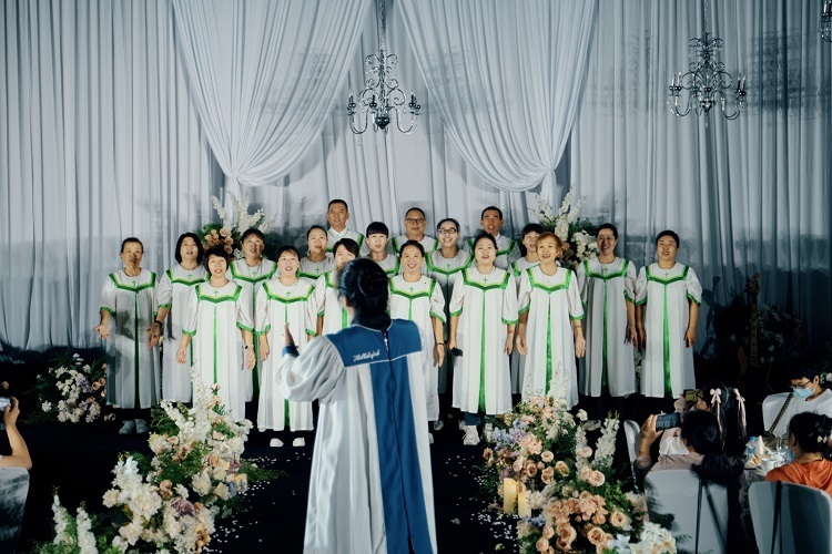 Choir members presented a hymn during a wedding service on an unknown day. 