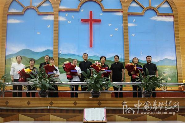 Five retired pastors took a group picture after a retirement service at Dawukou Church in Shizuishan, Ningxia, on July 25, 2024.