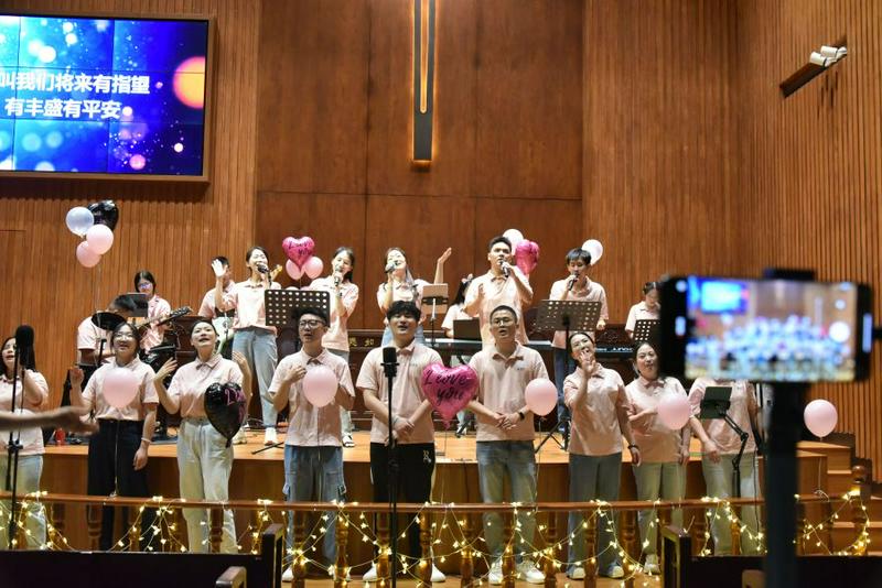 A youth praise team sang hymns at a praise meeting themed "It’s All for Love" at Shangdu Church in Fuzhou City, Fujian Province, on Chinese Valentine's Day, August 10, 2024.
