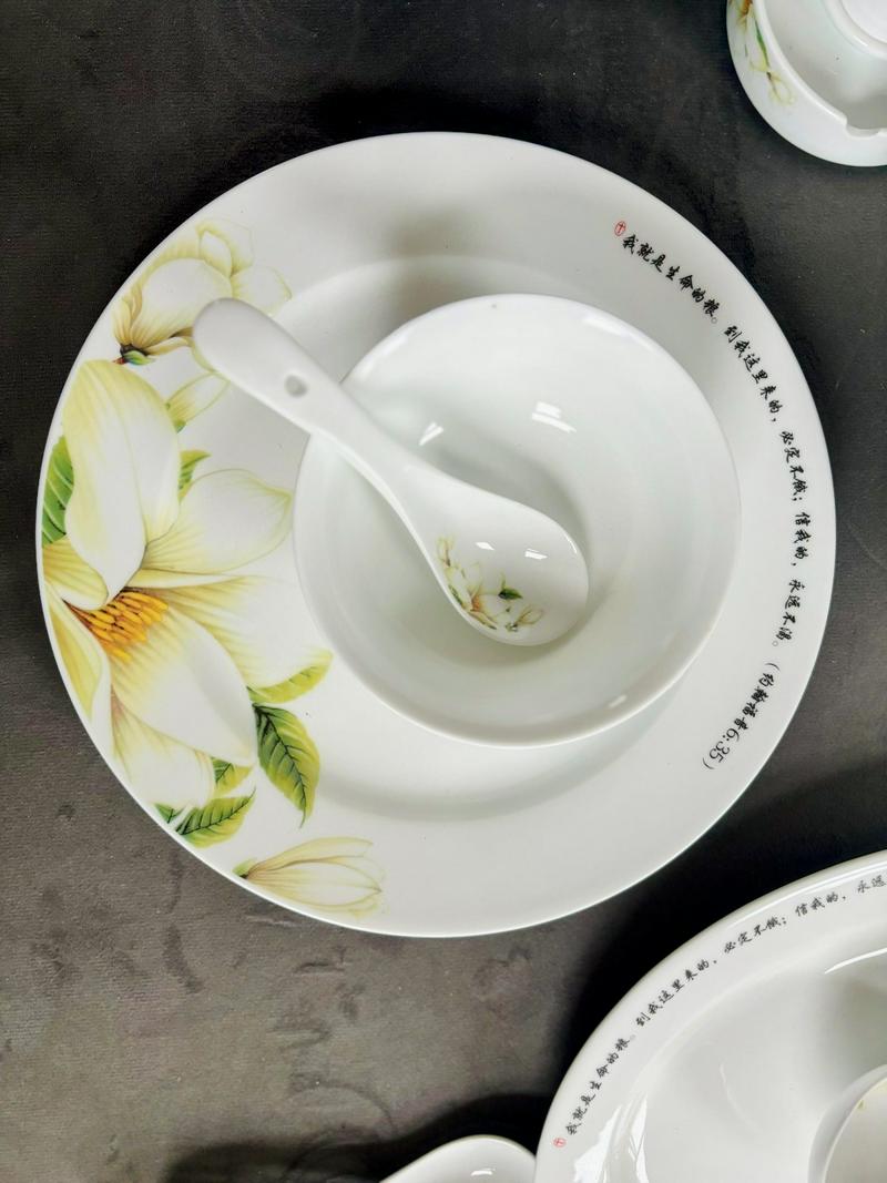 A detailed shot of porcelain tableware featuring scripture inscriptions.