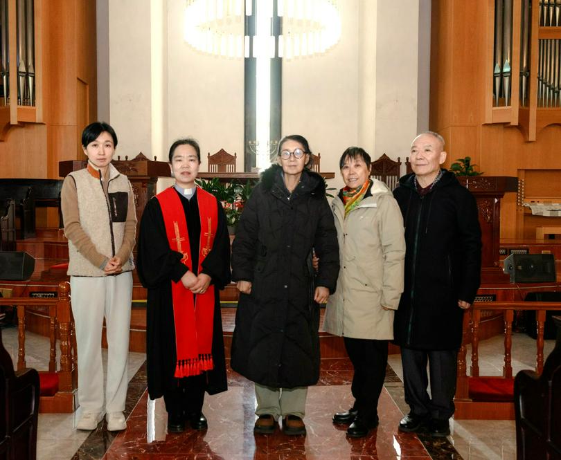 A commemorative picture was taken after the exclusive baptism for Sister Wu (middle) at the Chaoyang Church in Beijing on November 21, 2024.