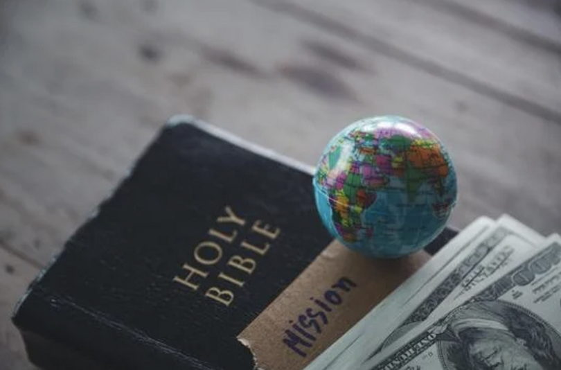 A globe with the Holy Bible for mission