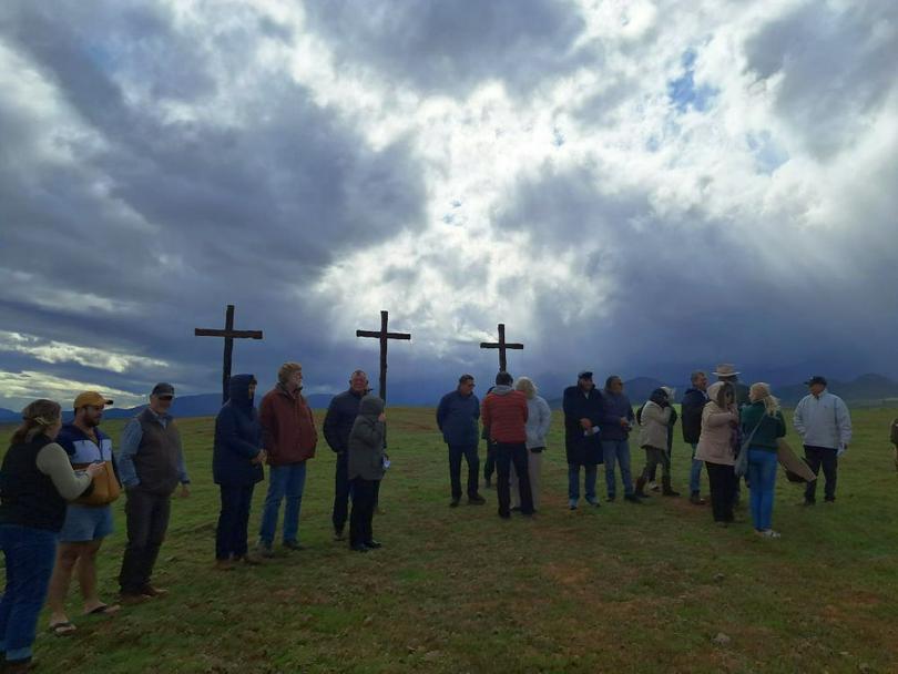 Prayer at the foot of the three crosses on the site of this weekend’s MMC Western Cape
