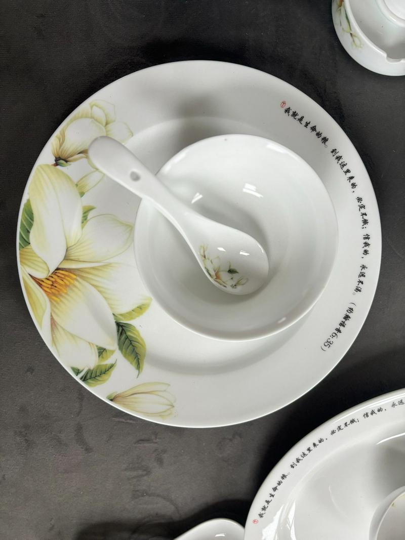 A detailed shot of porcelain tableware featuring scripture inscriptions