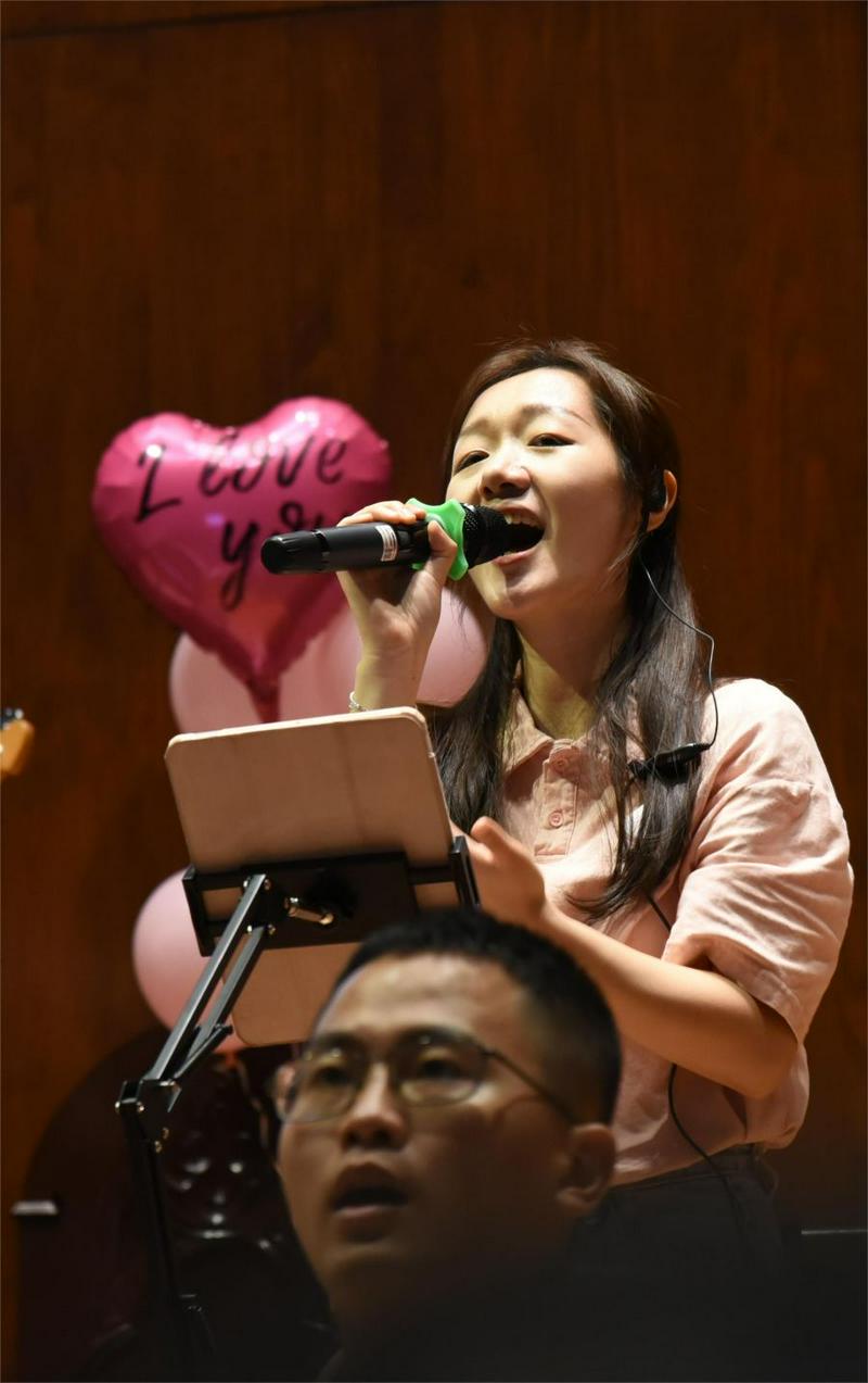 A woman believer performed at a themed praise meeting, "It’s All for Love," at Shangdu Church in Fuzhou City, Fujian Province, on Chinese Valentine's Day, August 10, 2024.