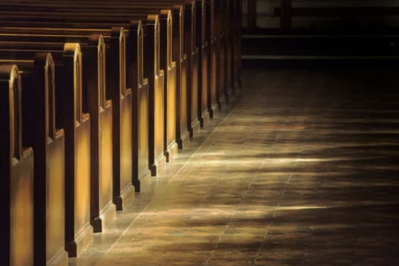 Church pews with sunlight on