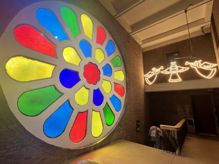 The picture of lighting angel decorations alongside the huge colorful lotus window at the Guangxiao Church in Guangzhou City, Guangdong Province, during the 2023 Christmas season