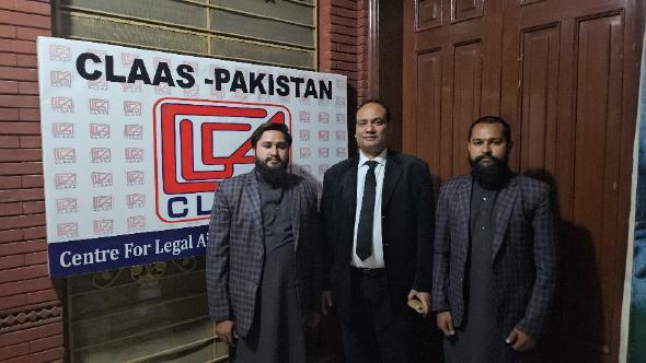 Umar and Umair Saleem with their lawyer, Tahir Bashir, center