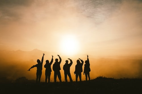 Six friends gather together to watch the sunrise.