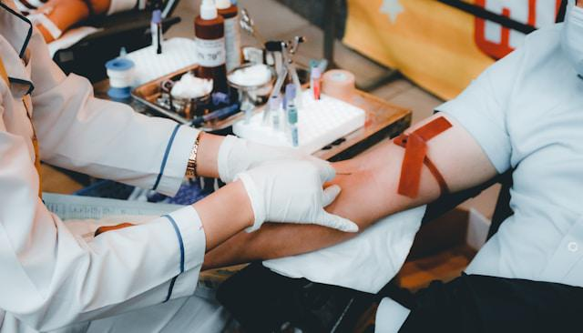 A man donates his blood at a blood station.