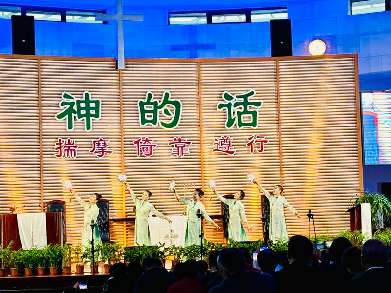 Church members in costumes performed a fan dance during a gathering marking Thanksgiving Day held at Fengtai Church in Beijing City on November 24, 2024.
