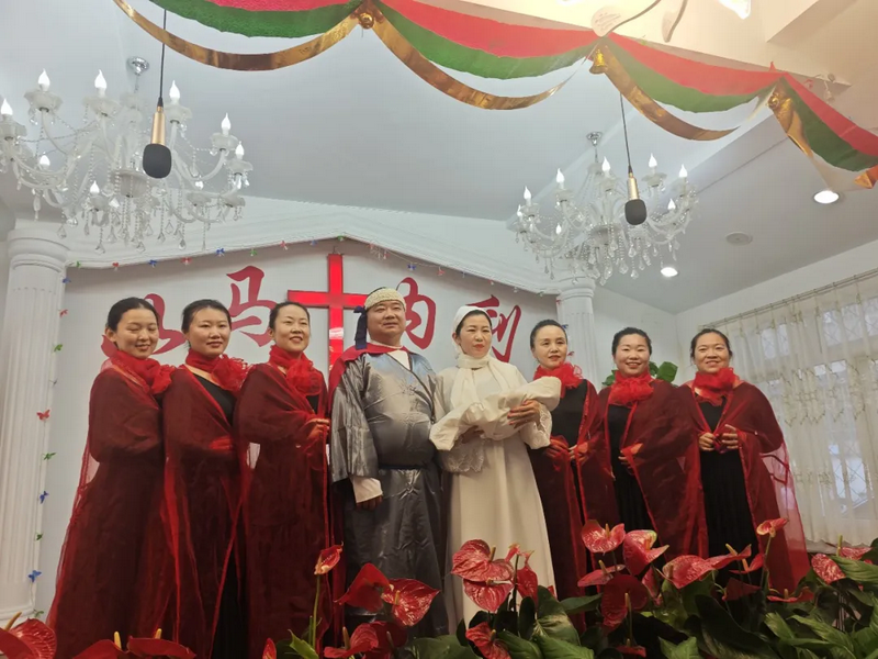 Christians in special costumes posed for a commemorative photo after performing a Christmas play at a church in Beijing during Christmas Week 2024.