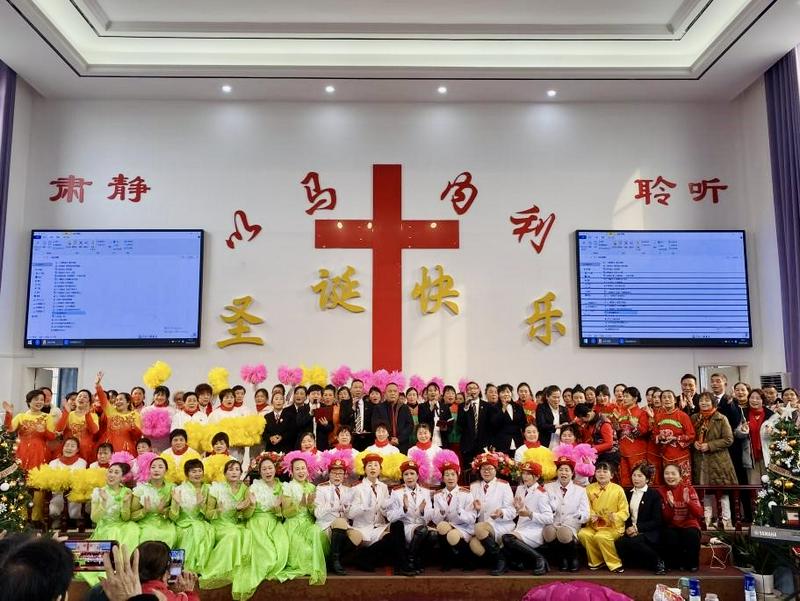 A commemorative photo of Christians in different festive costumes during a Christmas celebration at Chengxi Church in Huarong County, Yueyang City, Hunan Province, on December 25, 2024.