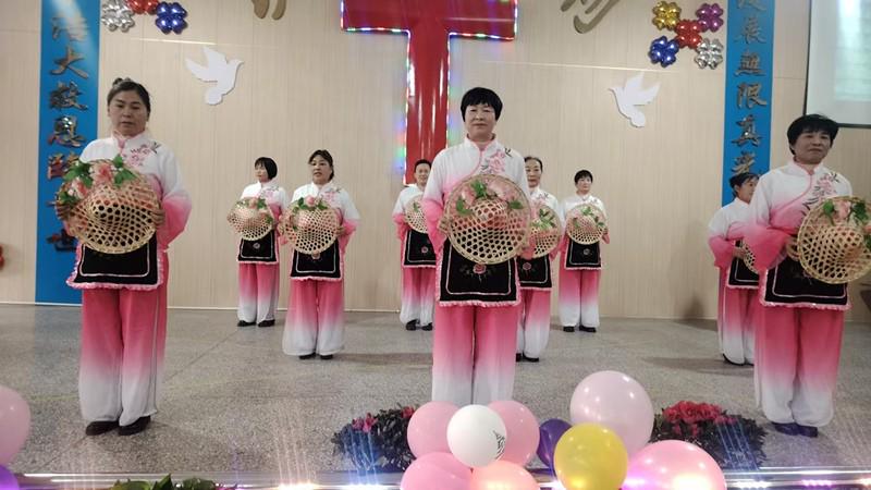 Christian women dressed in traditional Chinese costumes presented a dance to mark Christmas during the celebration worship service at Longgu Church in Pei County, Xuzhou City, Jiangsu Province, on December 25, 2024.