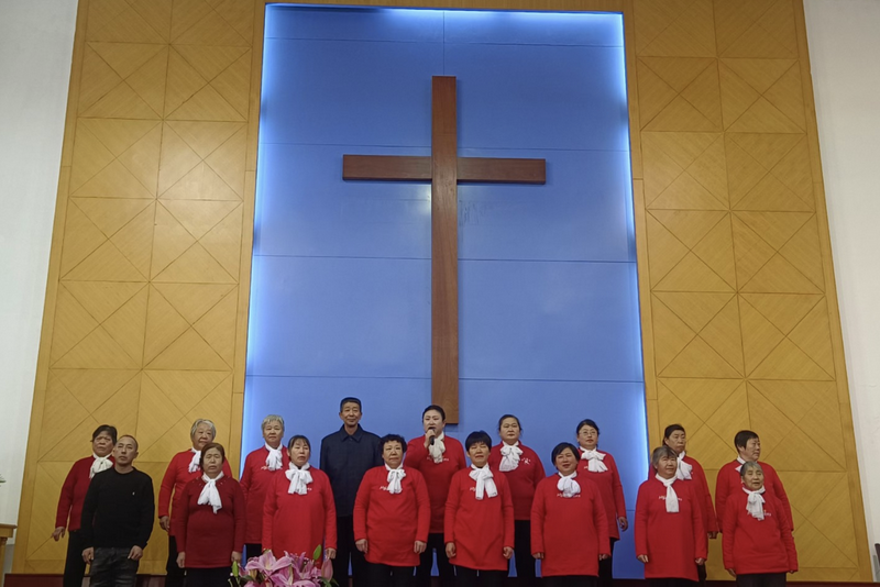 A group of senior believers dressed in red presented a performance in early celebration of Christmas at Penglai Church in Penglai City, Shandong Province, on December 22, 2024.
