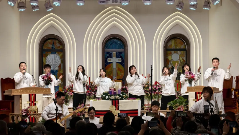 Young Christians performed during the praise gathering at Zhushikou Church in Beijing on January 1, 2024.