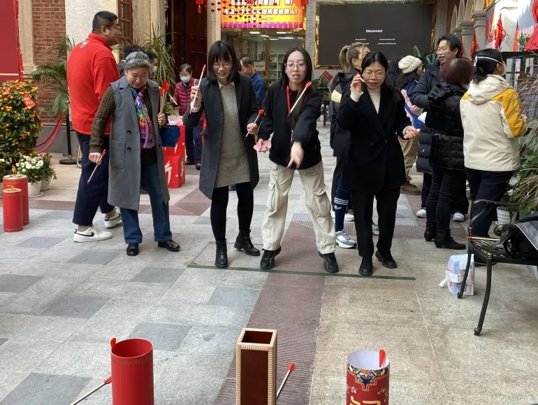 Congregants joined a game of throwing arrows into a distant pot during the Lantern Festival celebration at Savior Church in Guangzhou City, Guangdong Province, on February 9, 2025.