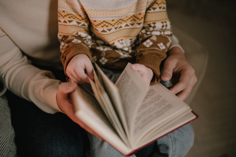 A picture of family reading Bible