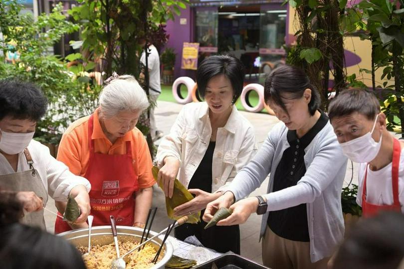 Chrstians engaged in the traditional method of making zongzi at Shenzhen Qiaocheng Church on May 27, 2025. 
