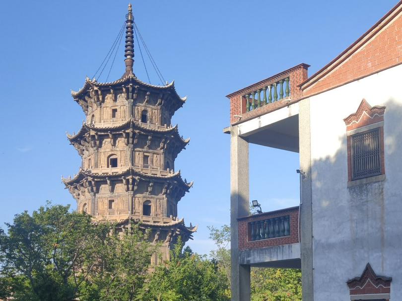 A pagoda near a house building in Quanzhou, Fujian Province 