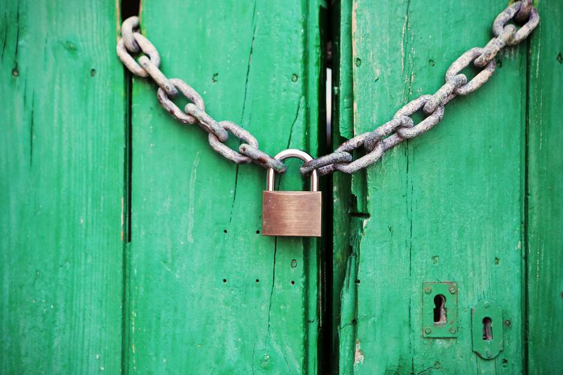 A green door is locked.