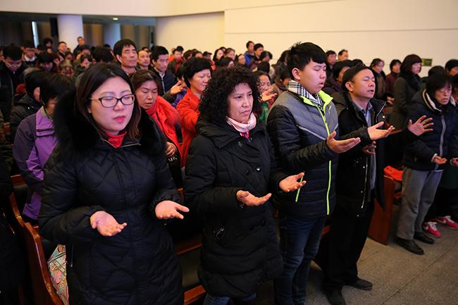 Congregation receiving blessing