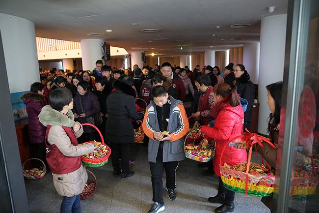 Pastoral Staff Distributing candies to the attendees