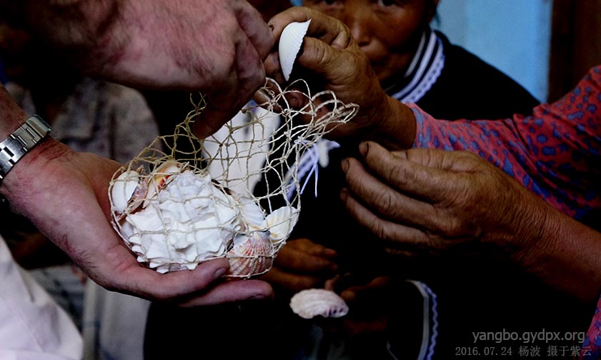 Steve with the Miao Shell from seashore of Florida (Photo provided to CCD)